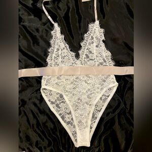 White one piece lingerie with lavender sash